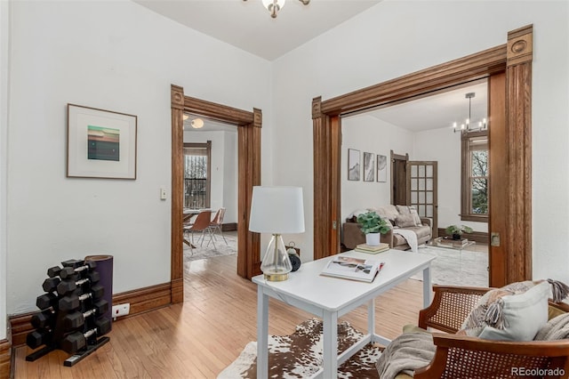 2719 W 32nd Ave, Denver, CO 80211 - home office with light wood-style flooring, a chandelier, and healthy amount of natural light
