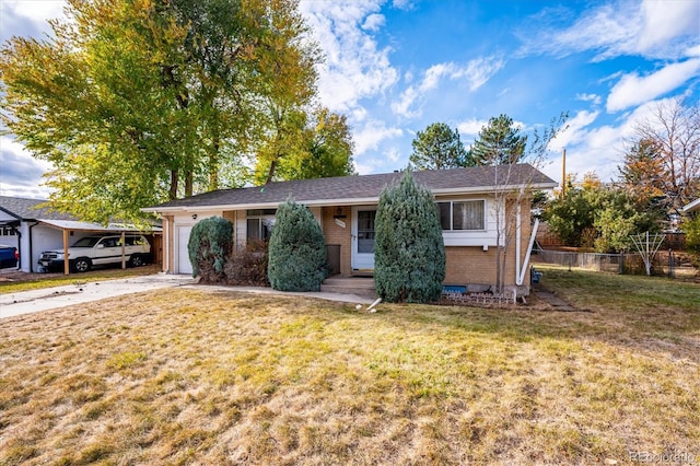 single story home with a front yard and a carport