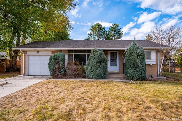 single story home with a front yard and a garage