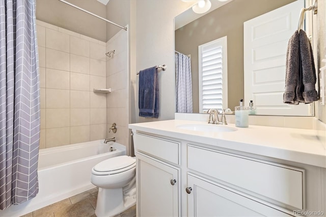 full bathroom with tile patterned floors, toilet, vanity, and shower / bath combo