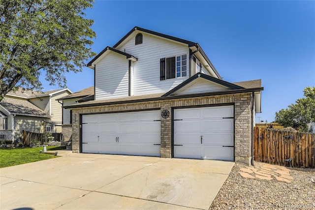 2251 W 135th Pl, Denver, CO 80234 - traditional home with concrete driveway, a garage, stone siding, and a shingled roof