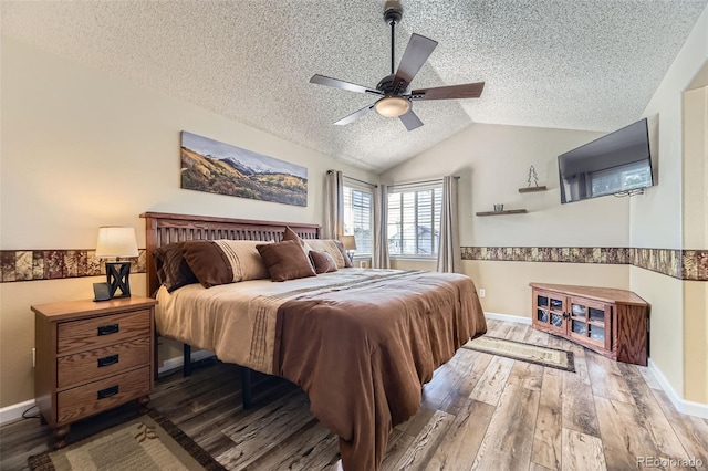 2251 W 135th Pl, Denver, CO 80234 - bedroom featuring a textured ceiling, wood finished floors, vaulted ceiling, and ceiling fan