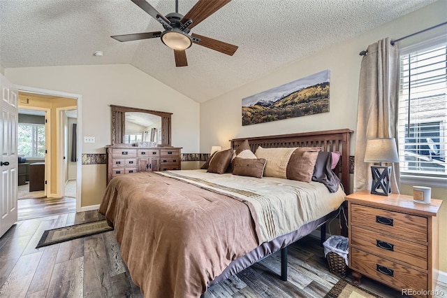 2251 W 135th Pl, Denver, CO 80234 - bedroom featuring wood finished floors, a textured ceiling, vaulted ceiling, and a ceiling fan