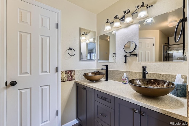 2251 W 135th Pl, Denver, CO 80234 - bathroom with double vanity and a textured wall