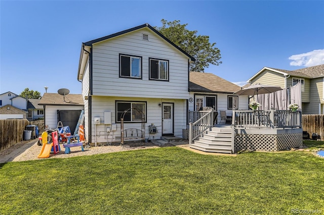2251 W 135th Pl, Denver, CO 80234 - back of property featuring a fenced backyard, a deck, and a shingled roof