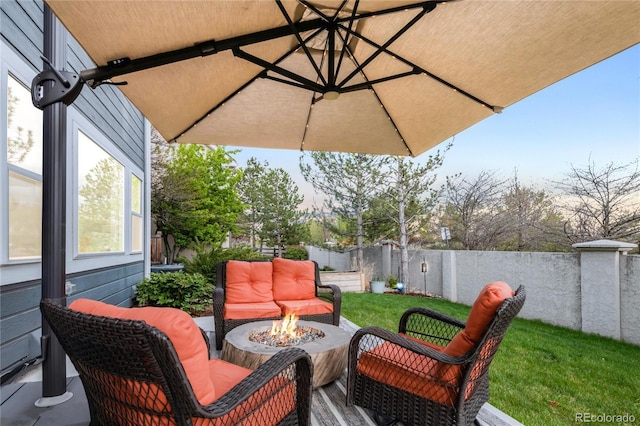 view of patio with a fenced backyard and a fire pit