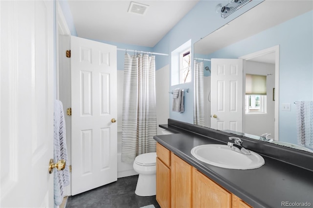 full bathroom featuring visible vents, shower / tub combo, toilet, and vanity