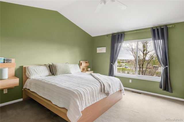 bedroom with ceiling fan, visible vents, vaulted ceiling, baseboards, and carpet