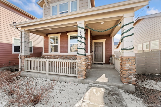 entrance to property featuring covered porch