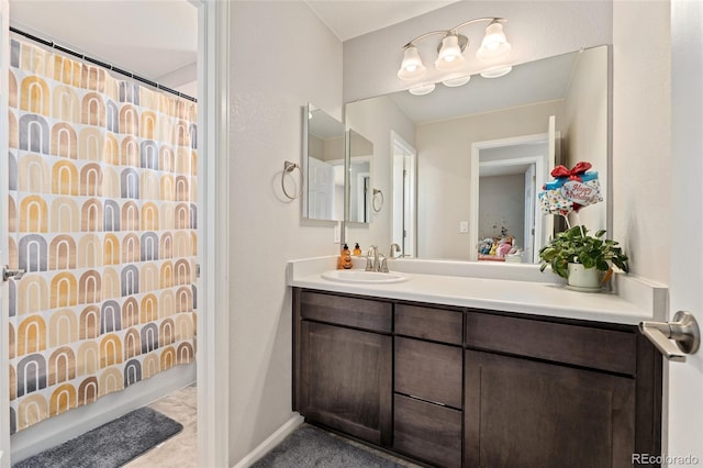 bathroom with shower / tub combo and vanity