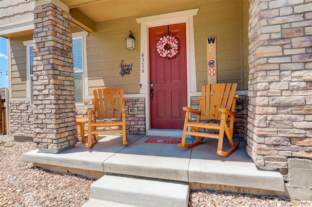 4316 S Netherland St, Aurora, CO 80015 - entrance to property with a porch and stone siding