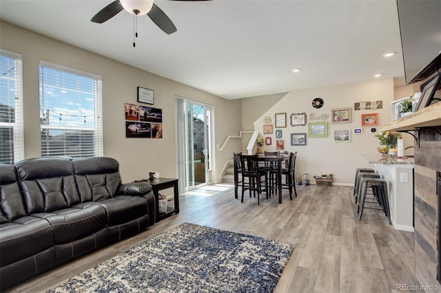 4316 S Netherland St, Aurora, CO 80015 - living room with stairs, ceiling fan, light wood finished floors, recessed lighting, and baseboards