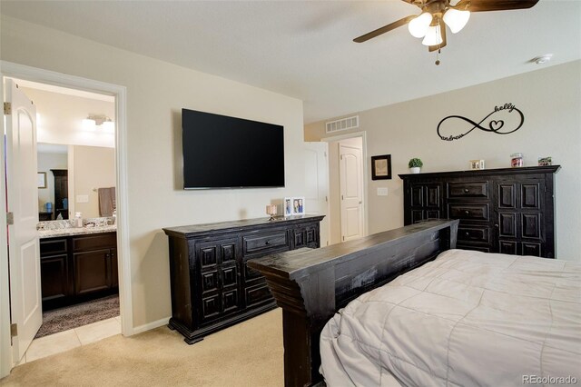 4316 S Netherland St, Aurora, CO 80015 - bedroom with light colored carpet, ensuite bath, ceiling fan, and baseboards