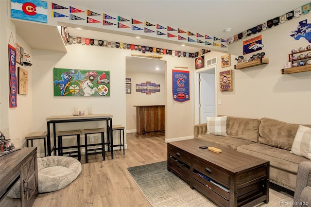 4316 S Netherland St, Aurora, CO 80015 - living room featuring wood finished floors, baseboards, and recessed lighting