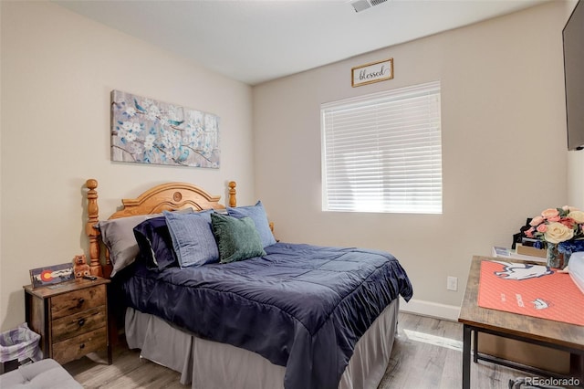 4316 S Netherland St, Aurora, CO 80015 - bedroom featuring light wood-style floors and baseboards