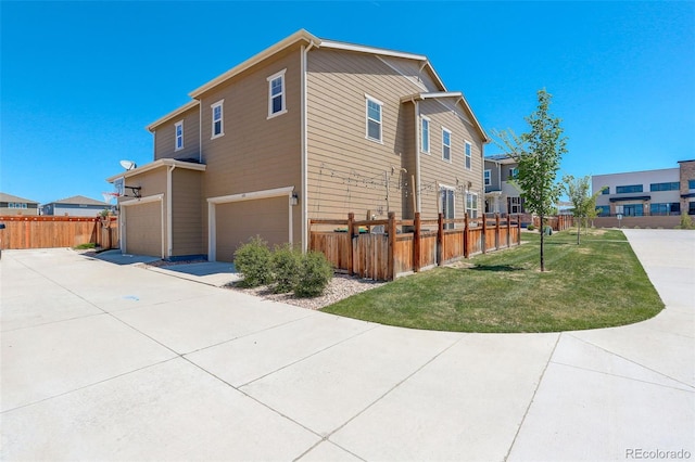 4316 S Netherland St, Aurora, CO 80015 - view of property exterior featuring an attached garage, driveway, and a residential view