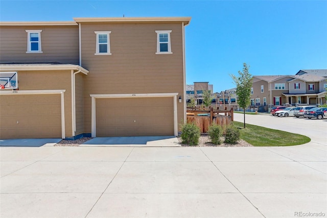 4316 S Netherland St, Aurora, CO 80015 - townhome / multi-family property featuring a residential view, a garage, and driveway