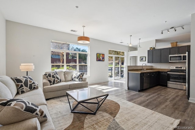 living room with wood finished floors and baseboards