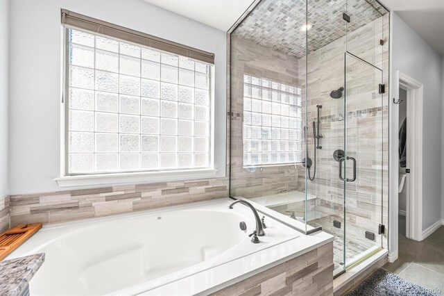 2373 S Joyce St, Denver, CO 80228 - bathroom with a garden tub and a stall shower