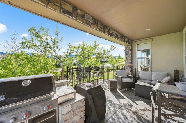 2373 S Joyce St, Denver, CO 80228 - view of patio / terrace featuring a grill, outdoor lounge area, and fence