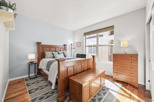 2373 S Joyce St, Denver, CO 80228 - bedroom featuring wood finished floors and baseboards