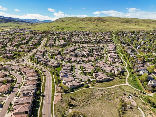 2373 S Joyce St, Denver, CO 80228 - aerial view of property and surrounding area featuring nearby suburban area and mountains