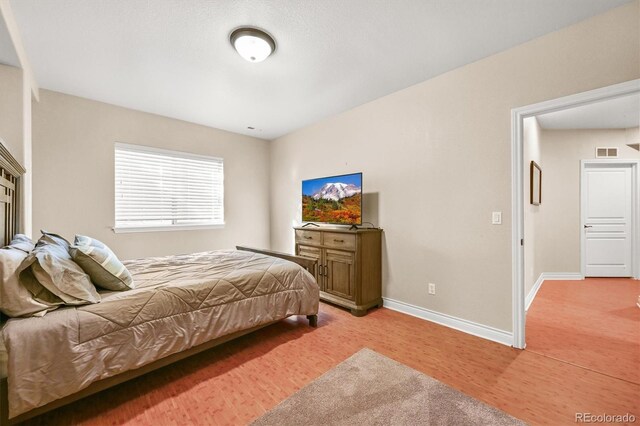 2373 S Joyce St, Denver, CO 80228 - bedroom featuring light wood-style flooring and baseboards