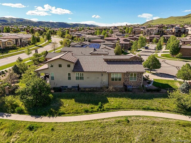 2373 S Joyce St, Denver, CO 80228 - aerial view of residential area featuring a mountainous background