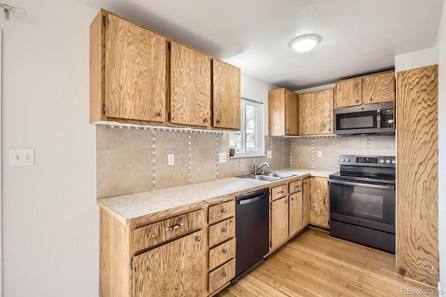 3021 11th Ave Unit 15, Evans, CO 80620 - kitchen featuring stainless steel microwave, range with electric cooktop, dishwasher, a sink, and light countertops