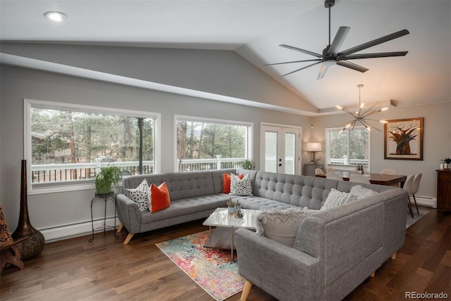 5382 S Pine Rd, Evergreen, CO 80439 - living area featuring a baseboard heating unit, a chandelier, plenty of natural light, and vaulted ceiling