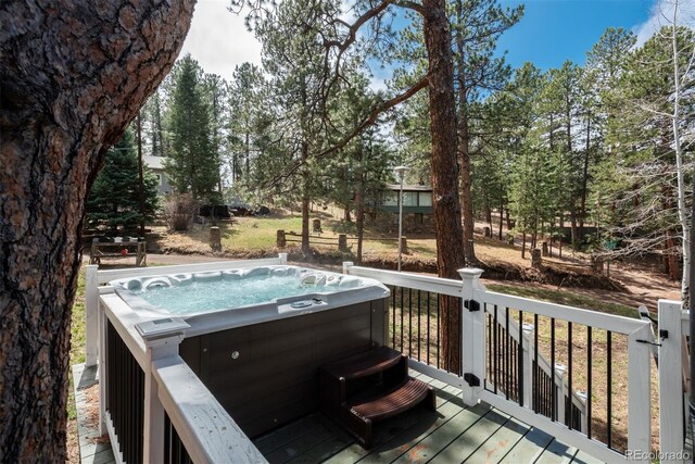 5382 S Pine Rd, Evergreen, CO 80439 - wooden deck featuring a hot tub