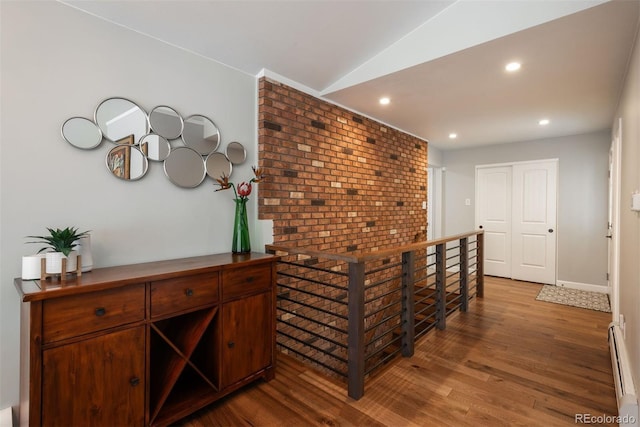 5382 S Pine Rd, Evergreen, CO 80439 - hall featuring a baseboard radiator, wood finished floors, vaulted ceiling, recessed lighting, and baseboards