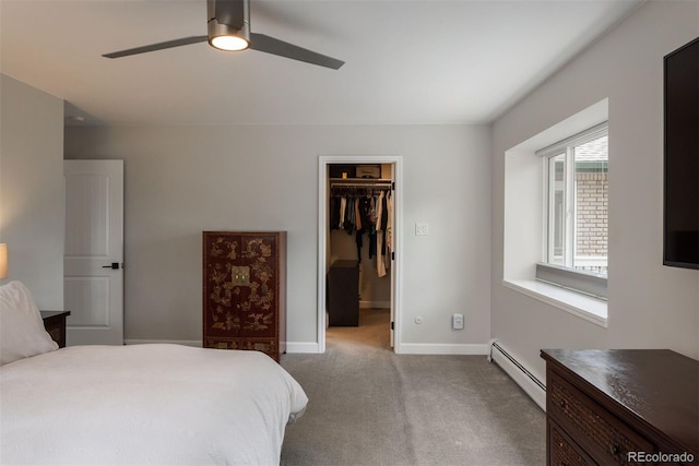 5382 S Pine Rd, Evergreen, CO 80439 - carpeted bedroom featuring a baseboard radiator, a spacious closet, baseboards, a closet, and a ceiling fan