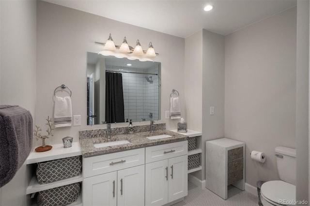 5382 S Pine Rd, Evergreen, CO 80439 - full bathroom featuring tiled shower, toilet, double vanity, recessed lighting, and baseboards