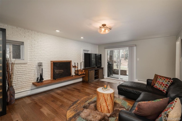 5382 S Pine Rd, Evergreen, CO 80439 - living room featuring wood finished floors and a baseboard radiator