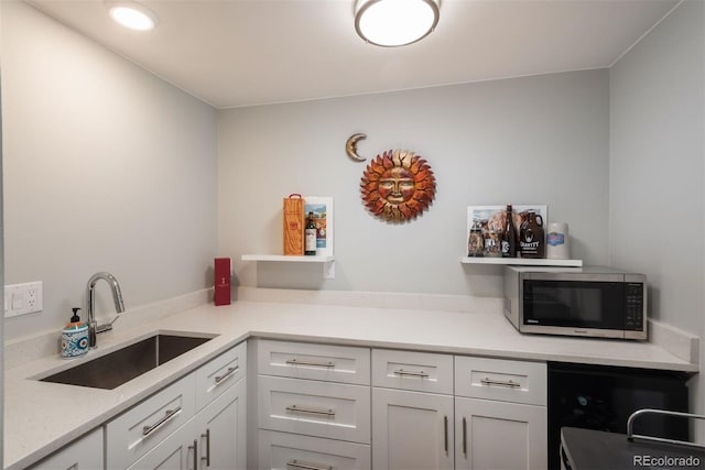 5382 S Pine Rd, Evergreen, CO 80439 - kitchen featuring stainless steel microwave, a sink, light countertops, and white cabinetry