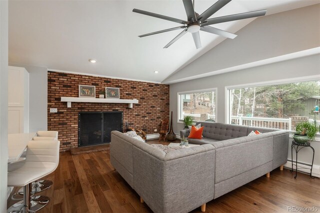 5382 S Pine Rd, Evergreen, CO 80439 - living area with wood finished floors, ceiling fan, recessed lighting, high vaulted ceiling, and a fireplace