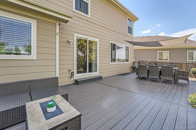 wooden terrace featuring outdoor dining space