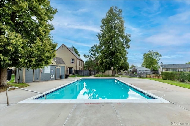 view of swimming pool with a patio area