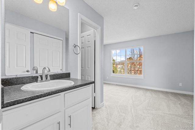 bathroom featuring vanity and a textured ceiling