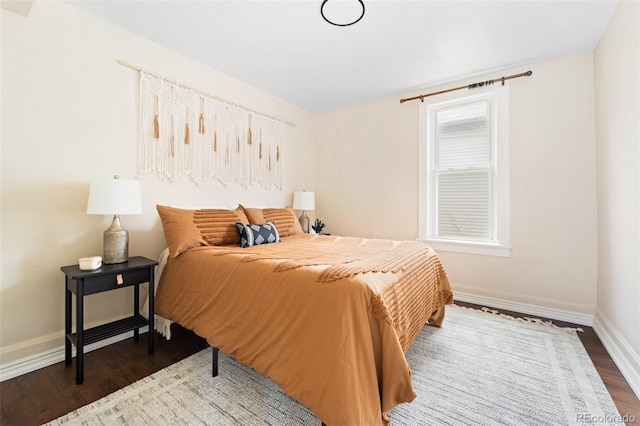 bedroom with hardwood / wood-style flooring