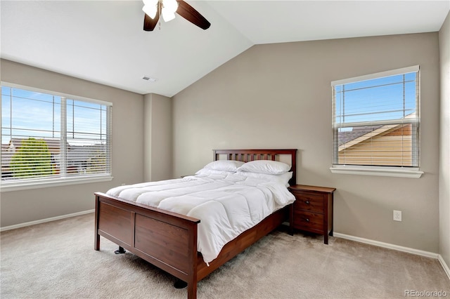 carpeted bedroom with vaulted ceiling, ceiling fan, visible vents, and baseboards