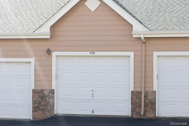 garage featuring wooden walls