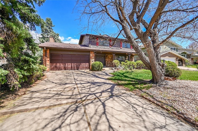 view of front of home featuring a garage, a chimney, driveway, and a porch