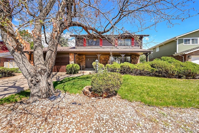 view of front of home featuring a porch, a front lawn, and stone siding