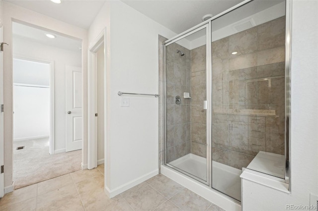 bathroom featuring tile patterned flooring, recessed lighting, baseboards, and a stall shower