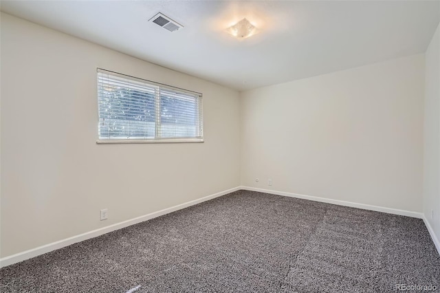 unfurnished room featuring carpet