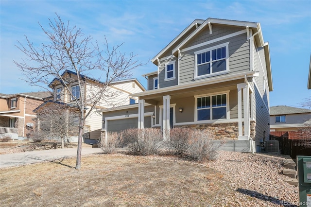 view of front of property with a garage, a porch, and cooling unit