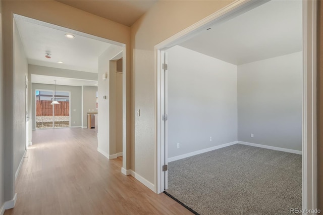 corridor featuring light hardwood / wood-style floors