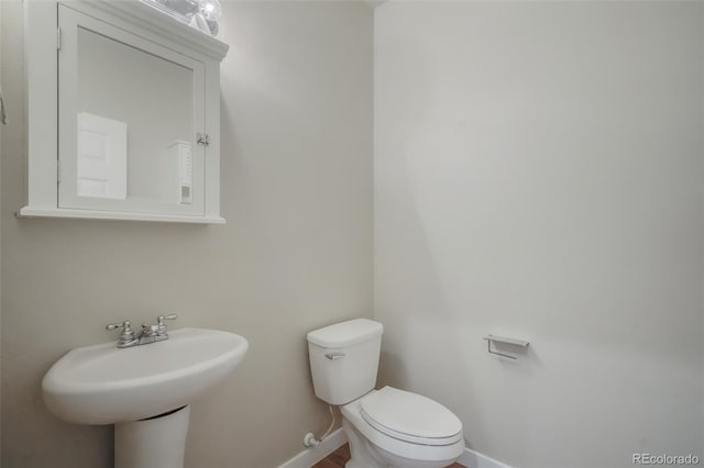 bathroom with toilet and sink